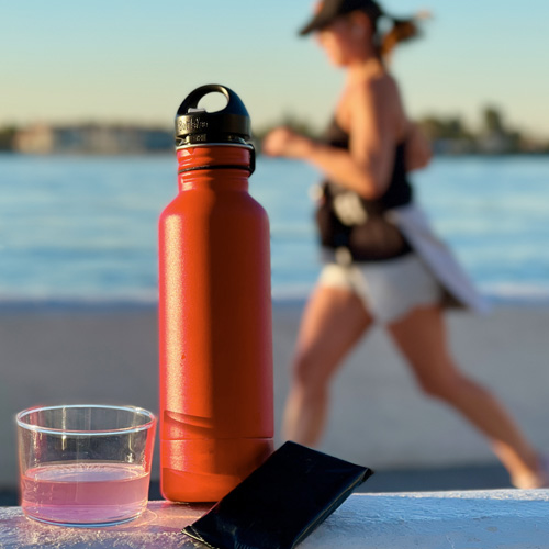 Red bottle woman running